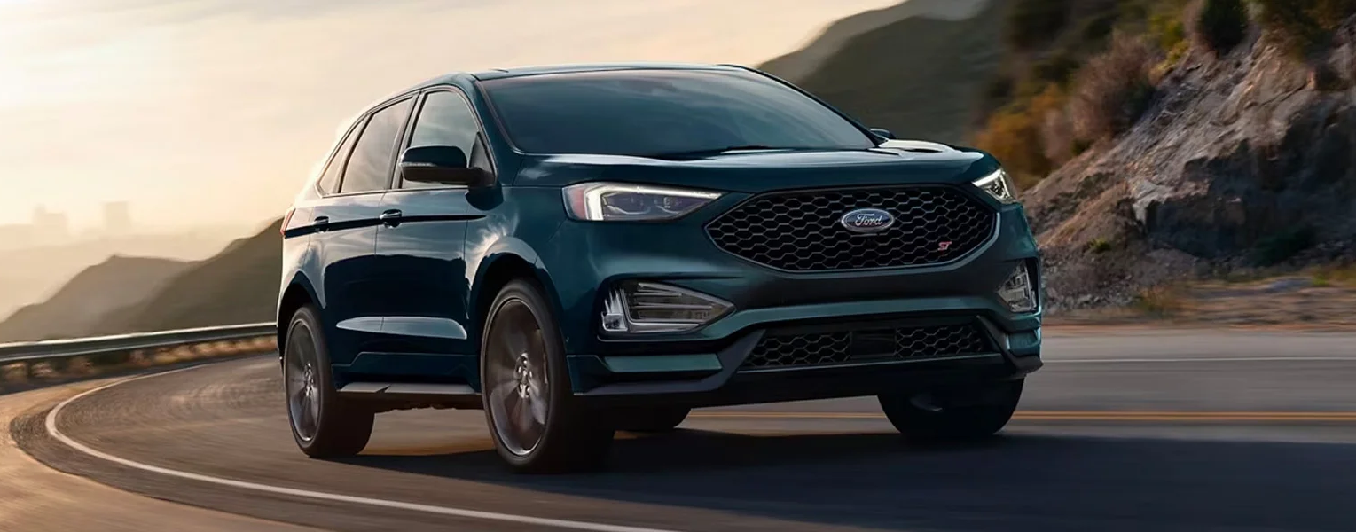 The 2024 Ford Edge driving on a scenic highway